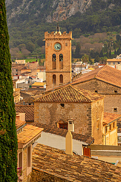 View of church clock tower and rooftops in the old town of Pollenca, Pollenca, Majorca, Balearic Islands, Spain, Mediterranean, Europe