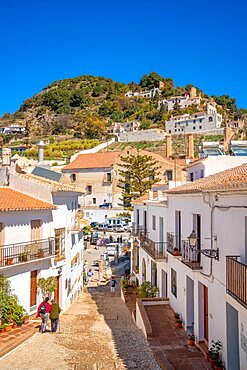 View of white washed houses and mountains in background, Frigiliana, Malaga Province, Andalucia, Spain, Europe