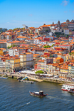 View of Douro River and terracota rooftops of The Ribeira district, UNESCO World Heritage Site, Porto, Norte, Portugal, Europe