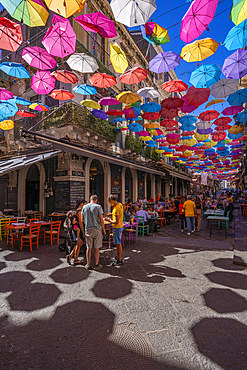 View of colourful umbrellas and restaurants on Via Gisira, Catania, Sicily, Italy, Mediterranean, Europe