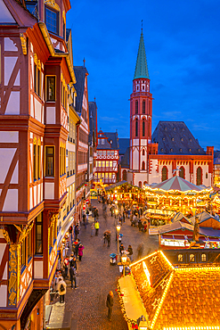 View of carousel and Christmas Market stalls at dusk, Roemerberg Square, Frankfurt am Main, Hesse, Germany, Europe