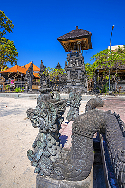 View of sculpture and Hindu Temple near Shelter Kebencanaan on Kuta Beach, Kuta, Bali, Indonesia, South East Asia, Asia