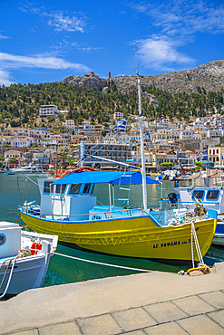 View of harbour boats in Kalimnos with hills in the background, Kalimnos, Dodecanese Islands, Greek Islands, Greece, Europe