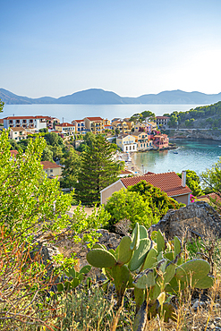 Elevated view of harbour and colourful houses in Assos, Assos, Kefalonia, Ionian Islands, Greek Islands, Greece, Europe