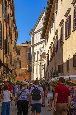 View of shops and shoppers in narrow street in Montepulciano, Montepulciano, Province of Siena, Tuscany, Italy, Europe