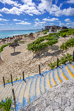 View of long white sandy beach at Playa Delfines, Hotel Zone, Cancun, Caribbean Coast, Yucatan Peninsula, Mexico, North America