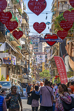 View of shops and decor on bustling Via San Biagio Dei Librai, Naples, Campania, Italy, Europe