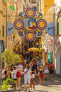 View of shops on Via Vittorio Emanuele in the fishing port, Procida, Phlegraean Islands, Gulf of Naples, Campania, Southern Italy, Italy, Europe