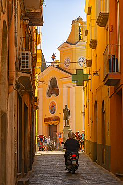 View of colourful narrow backstreet and Eglise Santa Maria delle Grazie, Procida, Phlegraean Islands, Gulf of Naples, Campania, Southern Italy, Italy, Europe