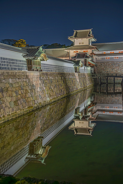 View of Gojikken Nagaya-Kanazawa Castle reflecting in moat at dusk, Kanazawa City, Ishikawa Prefecture, Honshu, Japan