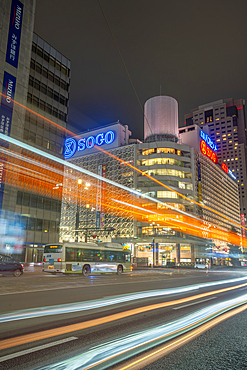 View of street scene, trail lights and shopping mall in Hiroshima at night, Hiroshima, Honshu, Japan