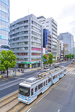 Elevated view of traffic and tram on major street during daytime, Hondori, Naka Ward, Hiroshima, Honshu, Japan