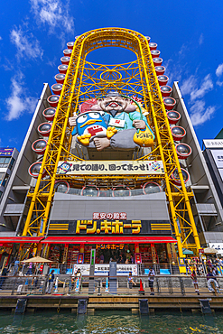 View of Ebisu Tower Ferris Wheel in Dotonbori, vibrant entertainment district near the river, Osaka, Honshu, Japan, Asia