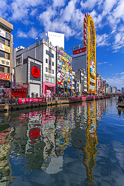 View of restaurants and Ebisu Tower Ferris Wheel in Dotonbori, vibrant entertainment district near the river, Osaka, Honshu, Japan, Asia