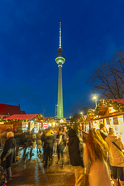 View of Berlin TV Tower and Christmas market in Wasserkaskaden at dusk, Mitte, Berlin, Germany, Europe