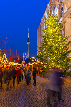 View of Christmas market stalls in Vorplatz Berliner Schloss at Christmas and Berlin TV Tower in background, Mitte, Berlin, Germany, Europe