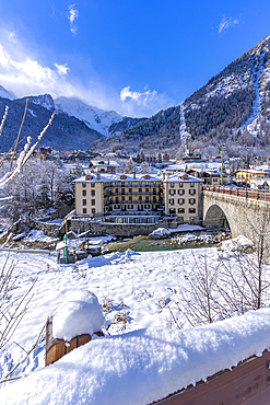 View of snow covered trees, mountains and Dolonne from Courmayeur during winter, Courmayeur, Aosta Valley, Italy, Europe