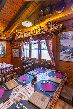 Interior view of typical wooden chalet cafe in Entrèves during winter, Entrèves, Aosta Valley, Italy, Europe