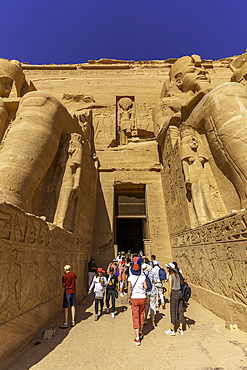 Exterior view of tourists and relief mural of Ebsambul or Isambul at the Abu Simbel Temple next to Lake Nasser, Temple of the Pharaohs, Ramses II, Nubia, Egypt, Africa