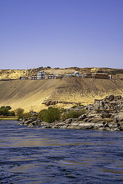View of architecture on the Nile river from small boat in Aswan, Aswan, Nubia, Egypt, North Africa, Africa