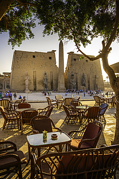 View of Luxor Temple and cafe during golden hour, Luxor, Egypt, Africa