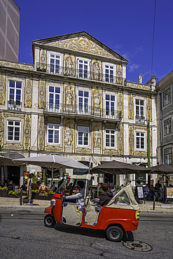 View of cafe and restaurant with Tuk Tuk in Lisbon city centre, Lisbon, Portugal, Europe