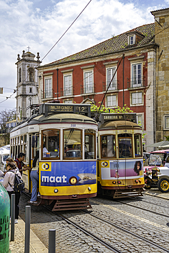 View of vintage trams and colourful architecture in Alfama, Alfama District, Lisbon, Portugal, Europe