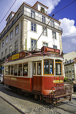 View of vintage tram narrow street in Alfama, Alfama District, Lisbon, Portugal, Europe