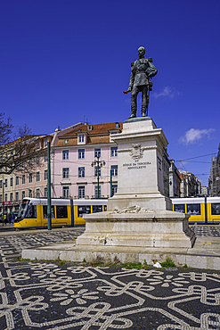 View of Duke of Terceira statue and a modern tram in PC Duque da Terceira on a sunny day, Lisbon, Portugal, Europe
