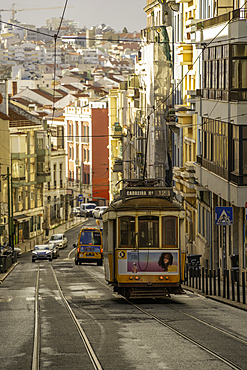 View of vintage tram and colourful buildings in the Alfama District on a sunny day, Lisbon, Portugal, Europe