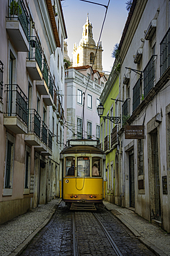 View of vintage tram and colourful buildings in the Alfama District on a sunny day, Lisbon, Portugal, Europe