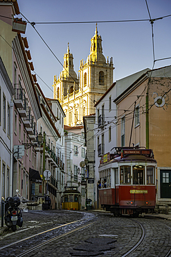 View of vintage tram and colourful buildings in the Alfama District on a sunny day, Lisbon, Portugal, Europe