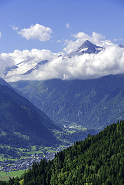 View of mountains toward Grossglockner from Plettsaukopf Reservoir on a sunny day, Bruckberg, Salzburg, Austria, Europe