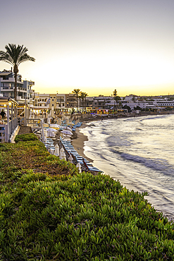 View of Palmowy Zakątek Beach at sunset, Limenas Chersonisou, Crete, Greek Islands, Greece, Europe