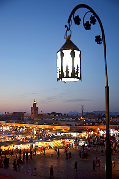 View over market square at dusk, Place Jemaa El Fna, Marrakesh, Morocco, North Africa, Africa