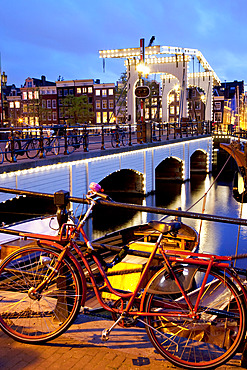 Magere Brug (Skinny Bridge) at dusk, Amsterdam, Holland, Europe
