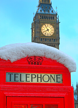 Red phone box and Big Ben in snow, Parliament Square, London, England, United Kingdom, Europe