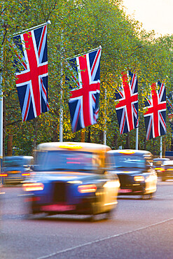 Black cabs along The Mall with Union Jack flags, London, England, United Kingdom, Europe