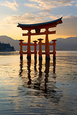 The floating Miyajima torii gate of Itsukushima Shrine at sunset, UNESCO World Heritage Site, Miyajima Island, Western Honshu, Japan, Asia