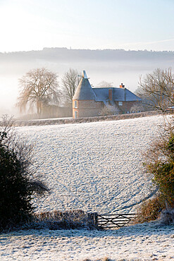 Old oast house in winter frost, Burwash, East Sussex, England, United Kingdom, Europe