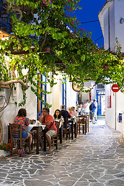 Outdoor restaurant in the old town of Plaka at night, Plaka, Milos, Cyclades, Aegean Sea, Greek Islands, Greece, Europe