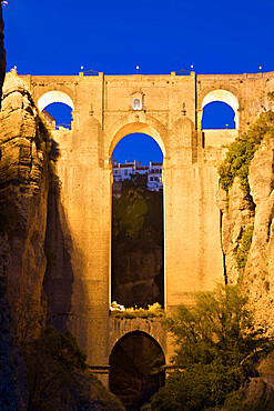 Puente Nuevo (New Bridge) floodlit at night, Ronda, Andalucia, Spain, Europe