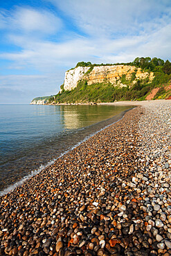 Shingle beach and cliffs of Seaton Hole at high tide, Seaton, Jurassic Coast, UNESCO World Heritage Site, Devon, England, United Kingdom, Europe