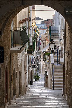 Narrow street and steep steps of Via Celestino V in early morning, Vieste, Gargano peninsula, Foggia province, Puglia, Italy, Europe