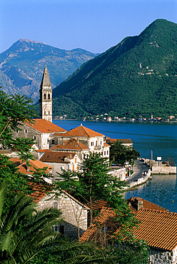 View over village with the church of St. Nikola belfry, Perast, The Boka Kotorska (Bay of Kotor), UNESCO World Heritage Site, Montenegro, Europe