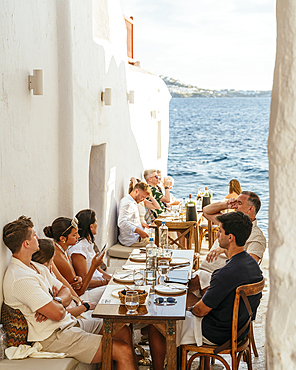 People at restaurant, Chora (Mykonos Town), Mykonos, Cyclades, Greek Islands, Greece, Europe