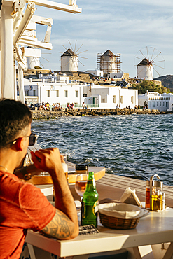 View from restaurant of windmills, Mykonos Town, Mykonos, Cyclades, Greek Islands, Greece, Europe