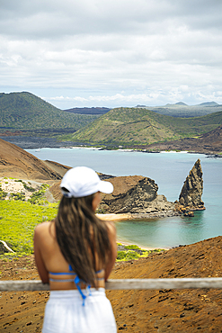 Tourist enjoying view, Isla Bartholomé, Galapagos Islands, Ecuador