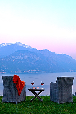 Armchairs and red wine with views of Lake Como at sunset, Lombardy, Italian Lakes, Italy, Europe