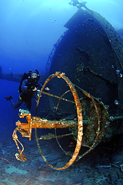 Mixed gas rebreather diver by crows nest of wrecked ship on seabed.  Red Sea.